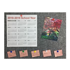 grey bulletin board with calendar, picture, and written notes