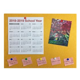yellow designer bulletin board with calendar, picture and pink written notes