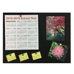 black bulletin board with calendar, pictures, and written notes